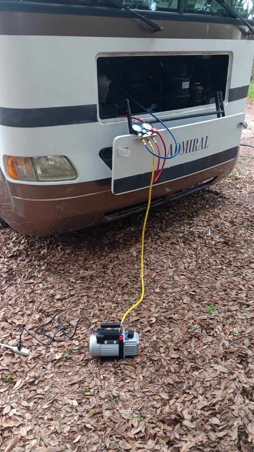 Motorhome air conditioning service with gauges and vacuum pump